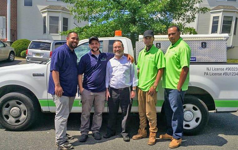 We Provide Efficient & Effective Pest Control Services a bugaboo service vehicle and employees at a delaware residence